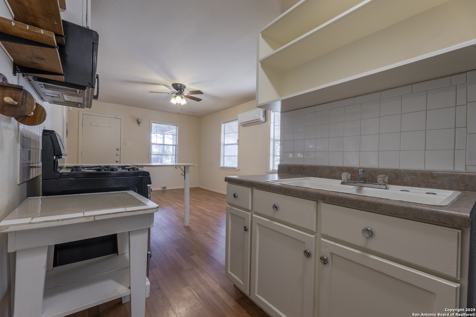 308 West Theo Avenue, Unit 2 San Antonio, TX 78214 - Photo 7 of 17 a kitchen with a sink appliances and cabinets