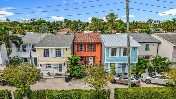 a aerial view of a house with a yard
