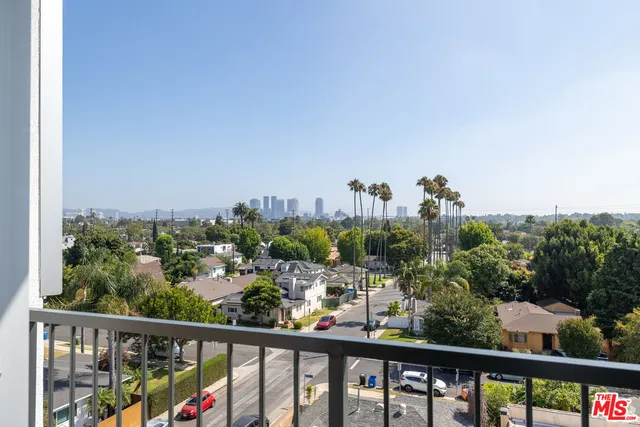 a view of a city skyline from a balcony