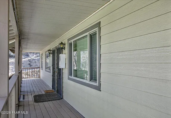a view of balcony with wooden floor