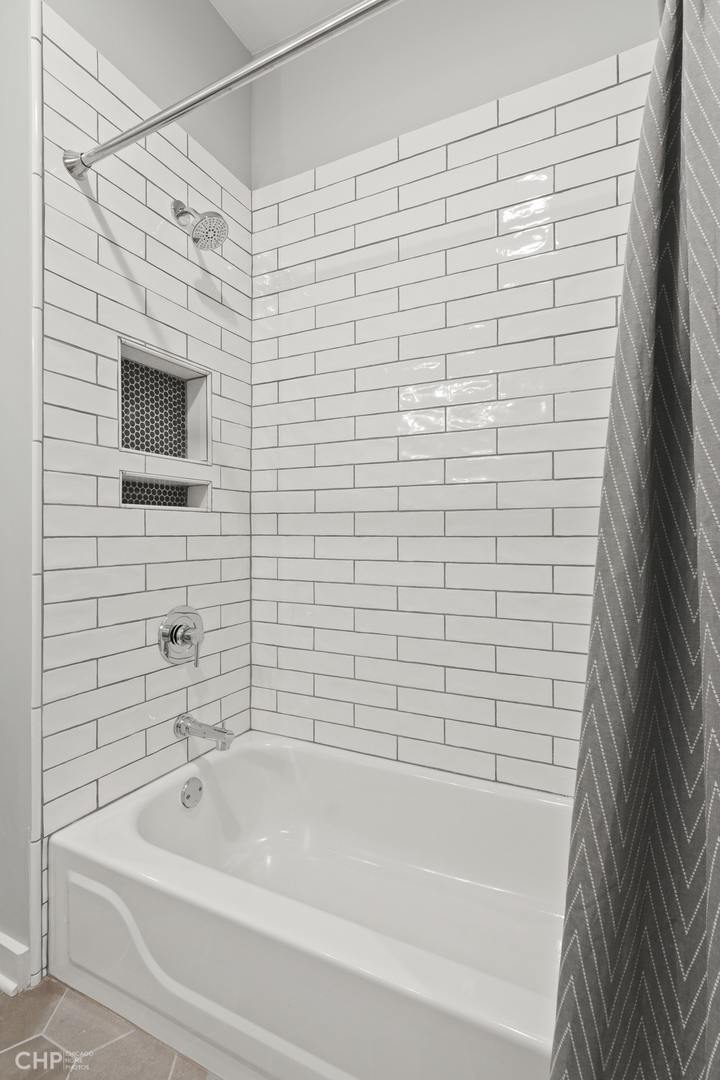 1354 West Fillmore Street, Unit A Chicago, IL 60607 - Photo 12 of 15 a bathroom with a bathtub and shower