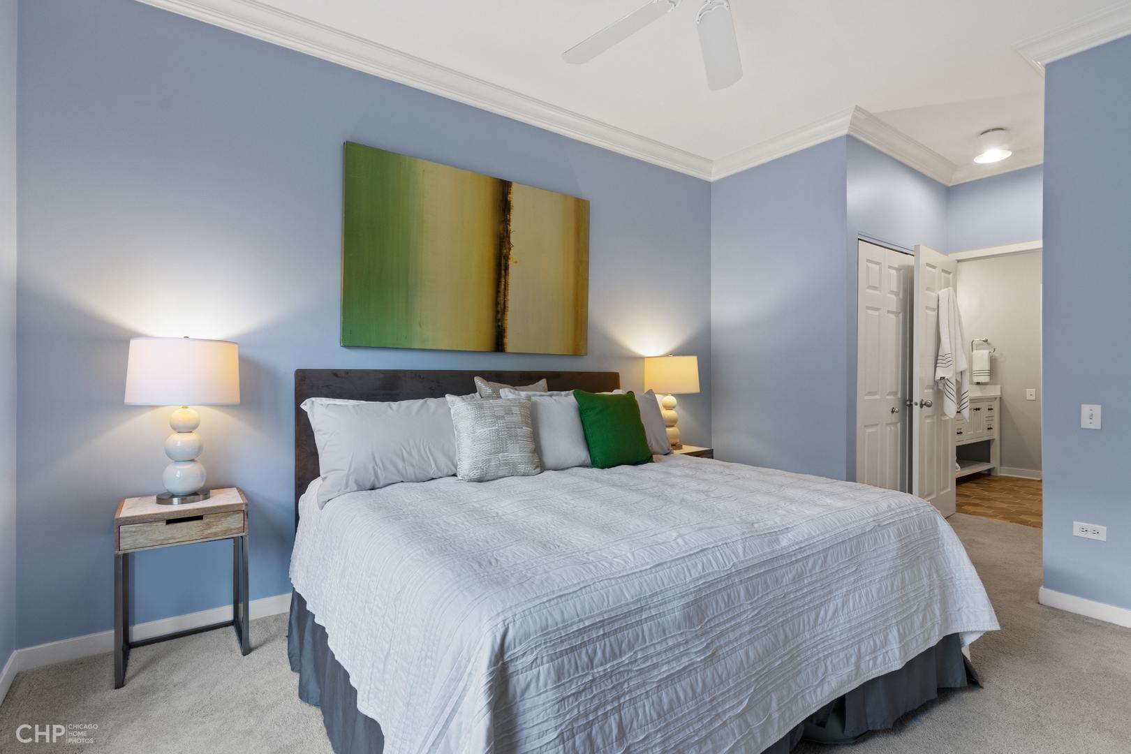 1354 West Fillmore Street, Unit A Chicago, IL 60607 - Photo 10 of 15 a bedroom with a bed and lamps