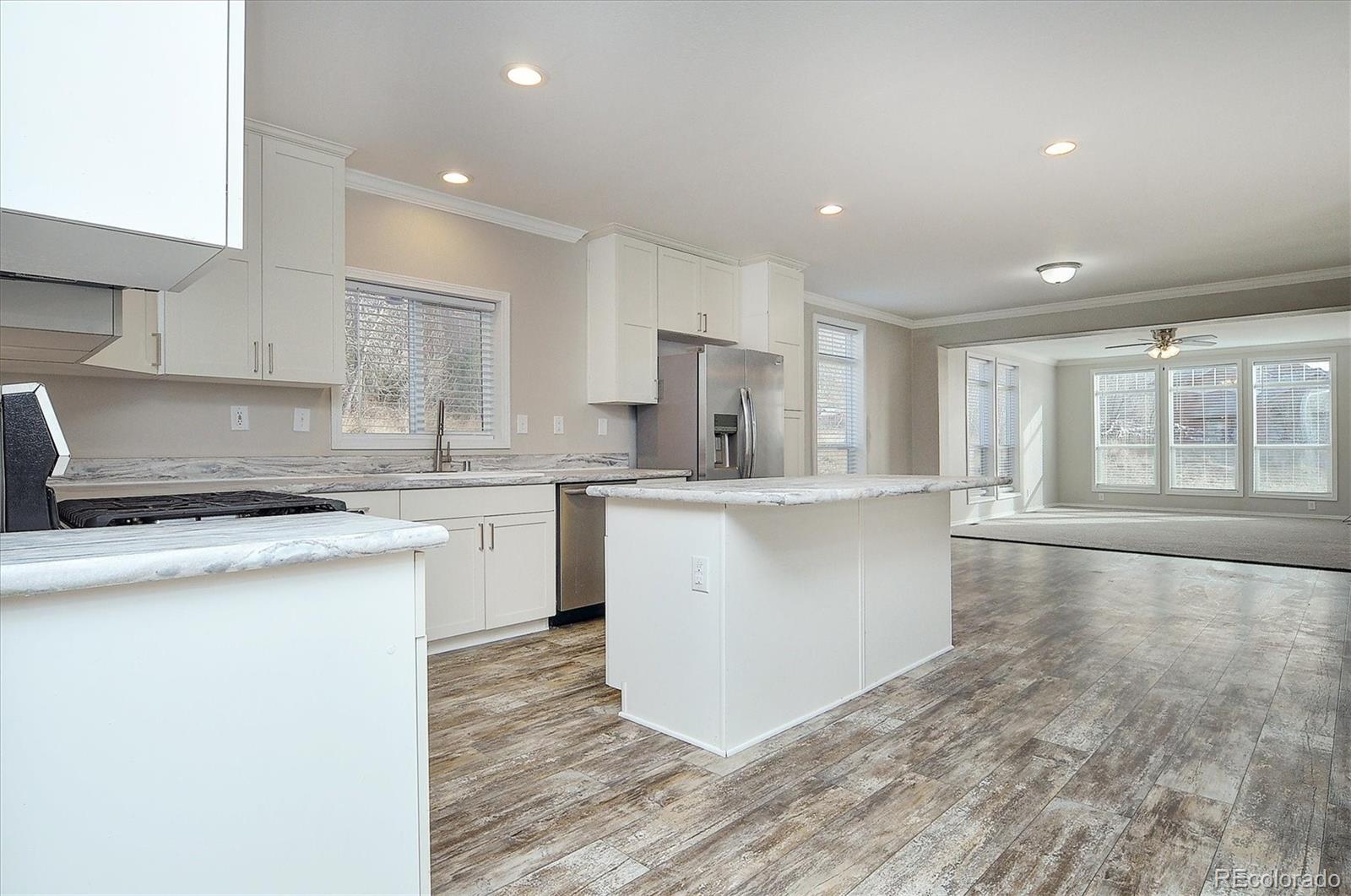 16554 Rocky Mountain Road Salida, CO 81201 - Photo 10 of 33 a kitchen with a stove a sink and a refrigerator
