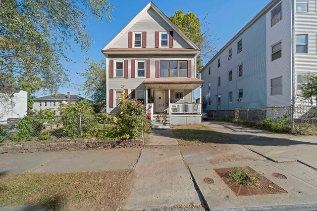 front view of a house with a yard