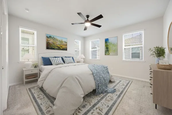 a bedroom with a large bed and a window