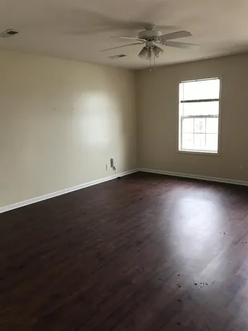 a kitchen with granite countertop a refrigerator and a sink