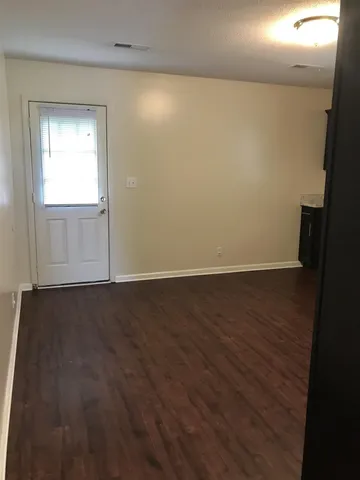 a view of backyard with green space