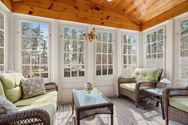 a living room with furniture and windows