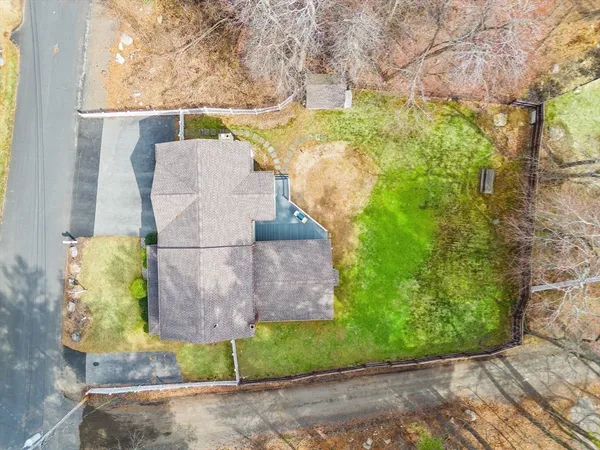 a bird view of a house along with trees