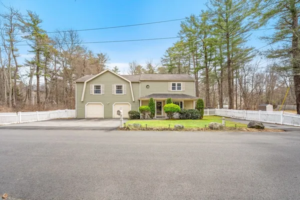 front view of house with a garden and pathway