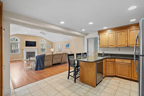 a kitchen with stainless steel appliances granite countertop a sink and counter space