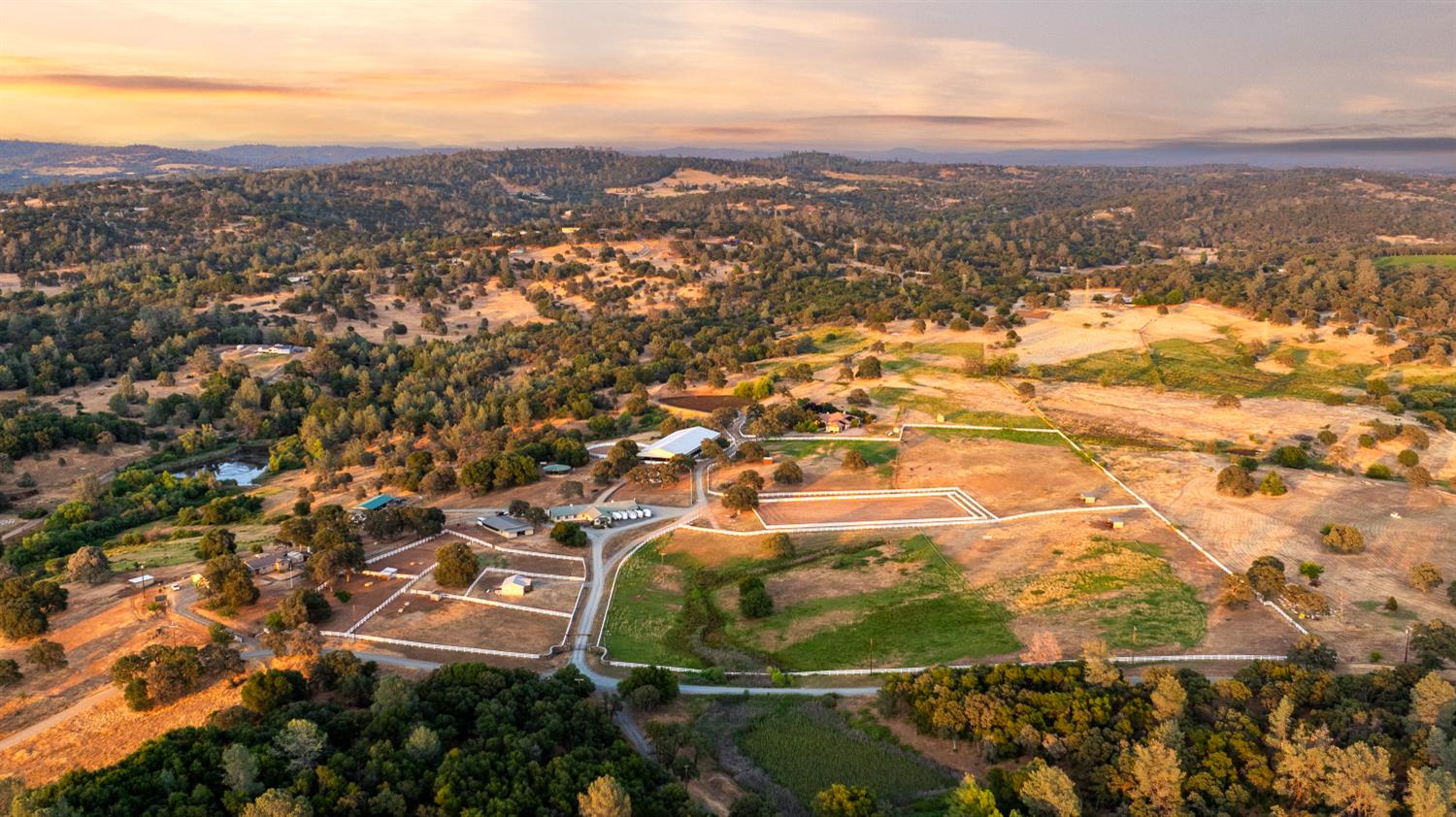 20945 Bear Hollow Road Grass Valley, CA 95949 - Photo 13 of 72 40 acre adjoining parcel is to the left and is also avail -2 residences, hay barn/ shop, pond, fenced pastures