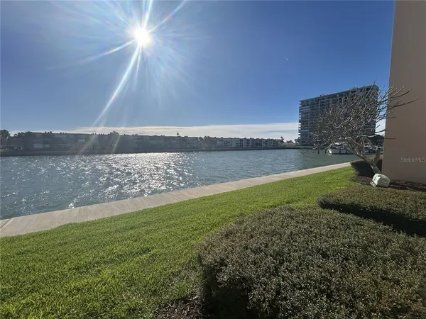 a view of a building with a yard