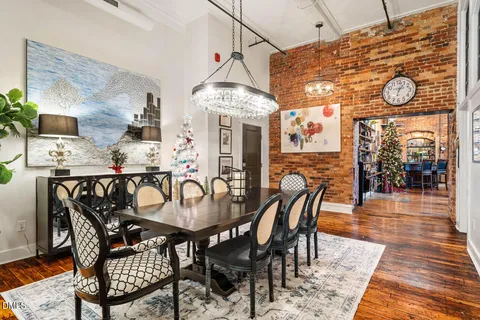 a dining room with furniture and window