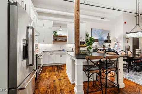 a very nice looking dining room with a table and chairs