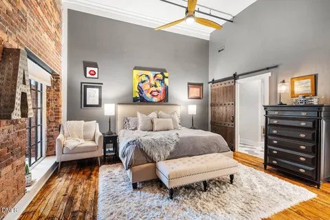 a bedroom with a bed and a couch