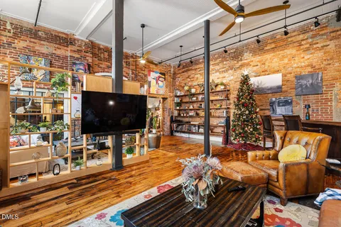 a outdoor living space with furniture and a flat screen tv