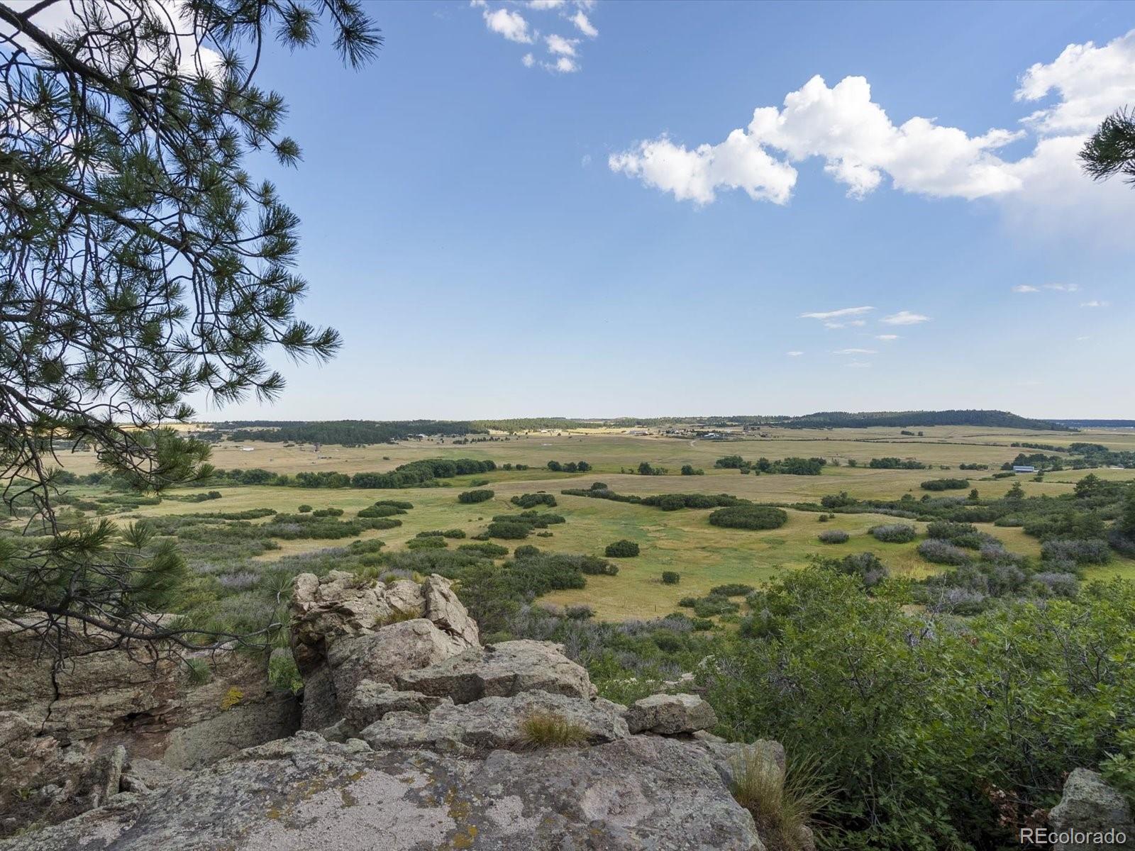 7750 East Greenland Road Franktown, CO 80116 - Photo 1 of 48 a view of an ocean