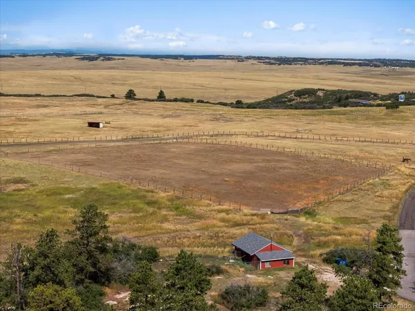 a view of an empty room with wooden walls