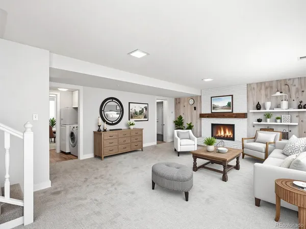 a kitchen with granite countertop a sink stainless steel appliances and window