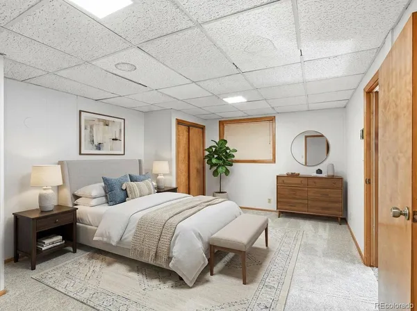 an empty room with windows and a fireplace