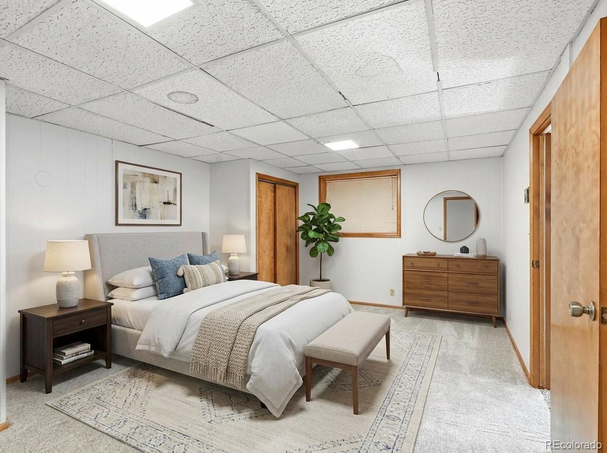7750 East Greenland Road Franktown, CO 80116 - Photo 33 of 48 a bedroom with a bed and a window