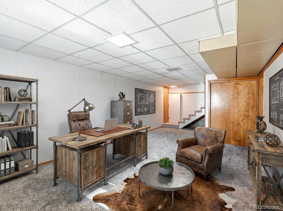7750 East Greenland Road Franktown, CO 80116 - Photo 34 of 48 a living room with furniture and a wooden floor