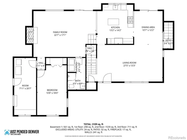 a view of a yard with wooden fence