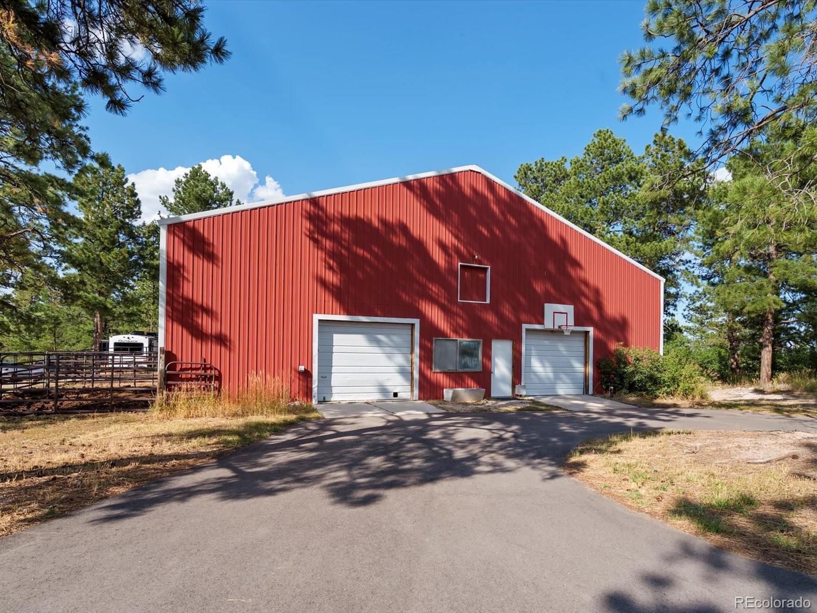 7750 East Greenland Road Franktown, CO 80116 - Photo 4 of 48 a view of a building with a street