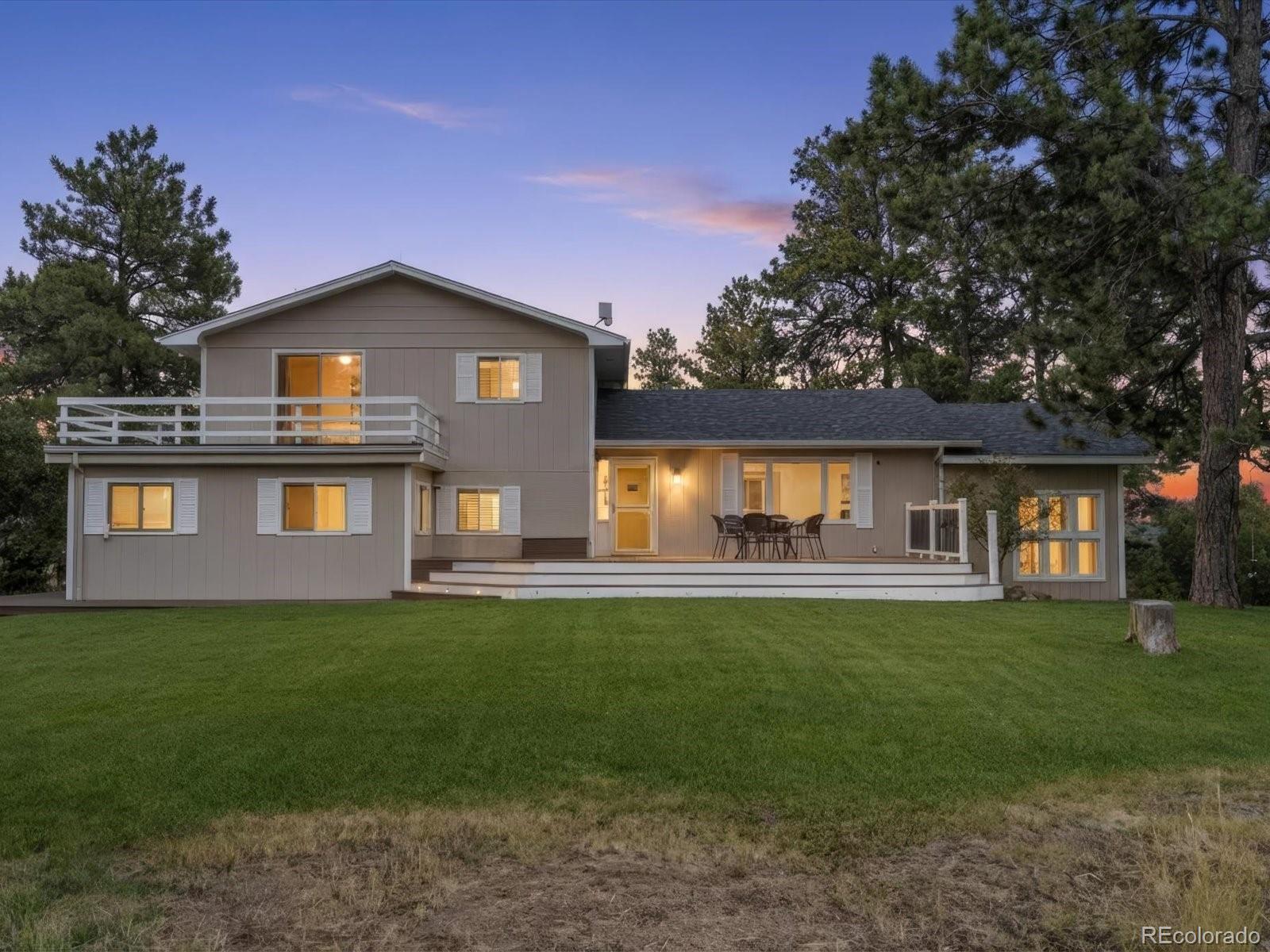 7750 East Greenland Road Franktown, CO 80116 - Photo 45 of 48 a front view of a house with a yard