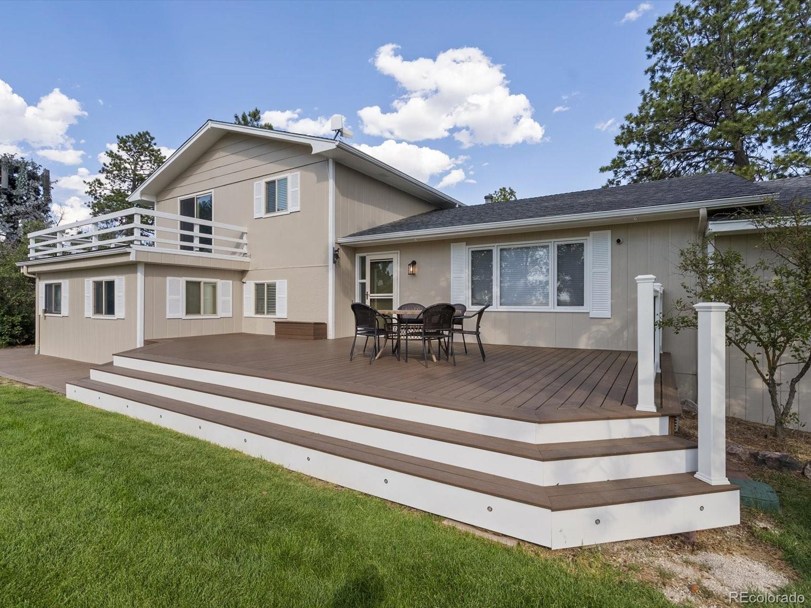 7750 East Greenland Road Franktown, CO 80116 - Photo 8 of 48 a view of a house with a patio