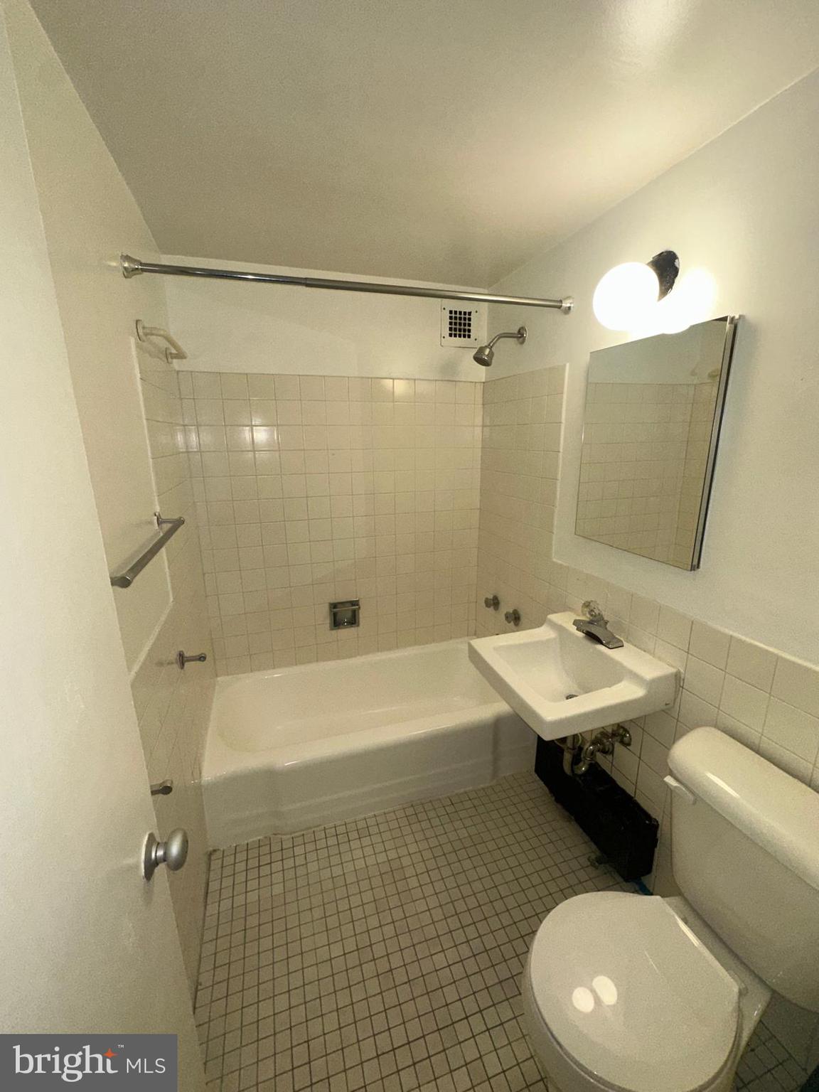 1301 Delaware Avenue Southwest, Unit N602 Washington, DC 20024 - Photo 12 of 22 a bathroom with a sink toilet and shower