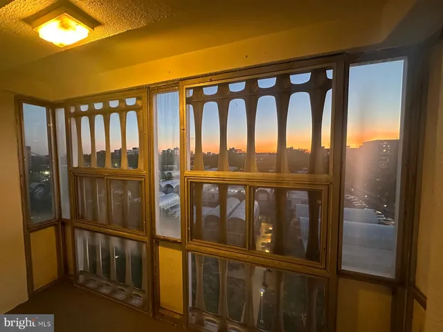 a view of a lobby with a couch and a rug