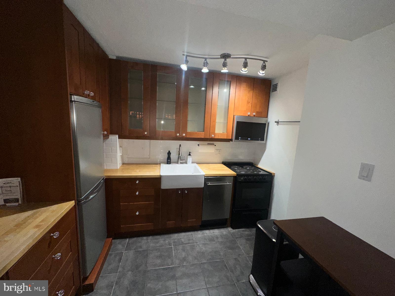1301 Delaware Avenue Southwest, Unit N602 Washington, DC 20024 - Photo 7 of 22 a kitchen with a sink and cabinets