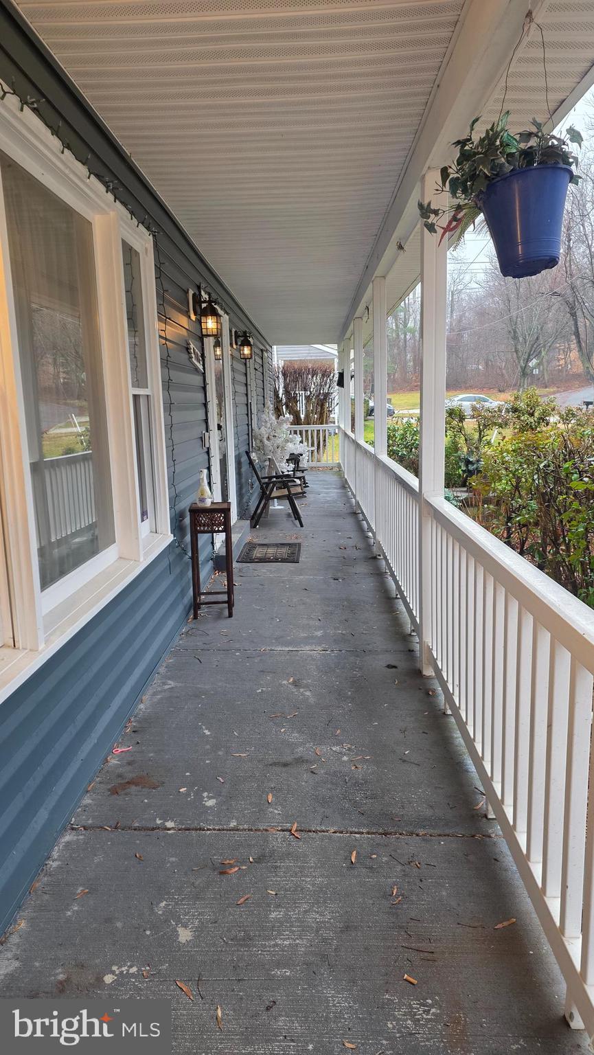 9104 Trumps Hill Road Upper Marlboro, MD 20772 - Photo 2 of 11 a view of a porch with seating space