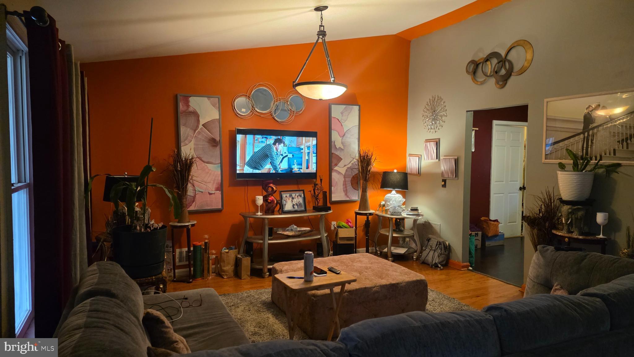 9104 Trumps Hill Road Upper Marlboro, MD 20772 - Photo 3 of 11 a living room with furniture a rug and a flat screen tv