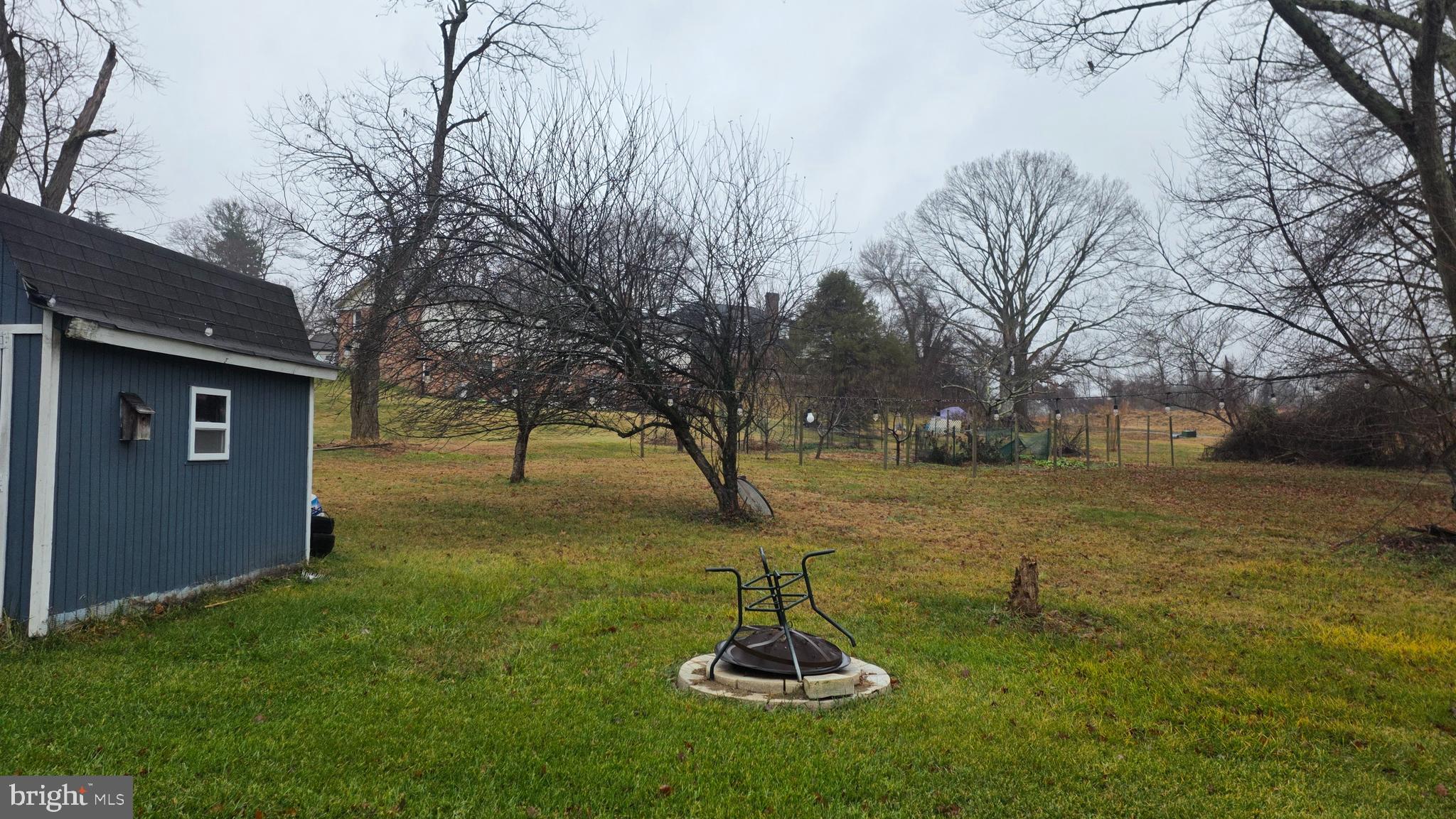 9104 Trumps Hill Road Upper Marlboro, MD 20772 - Photo 8 of 11 a view of a backyard with a garden