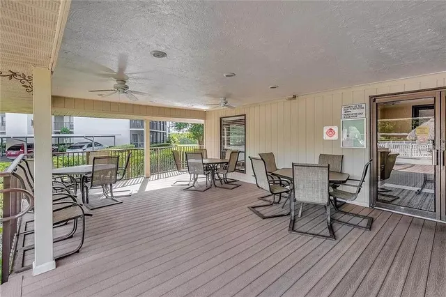 a dining room with furniture window and wooden floor