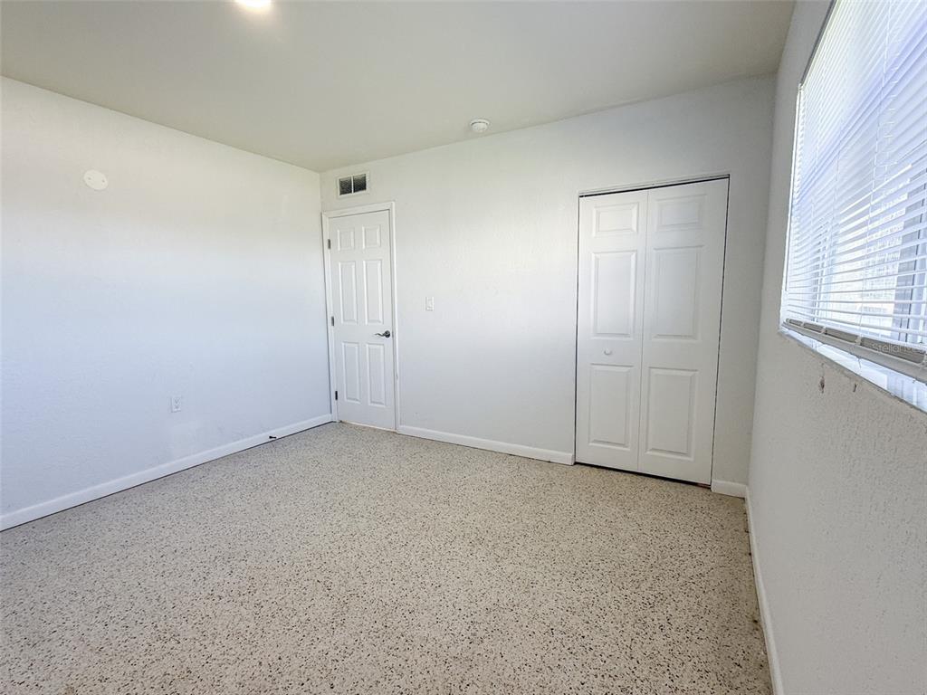 111 177th Avenue West, Unit 3 Redington Shores, FL 33708 - Photo 12 of 16 a view of an empty room and window