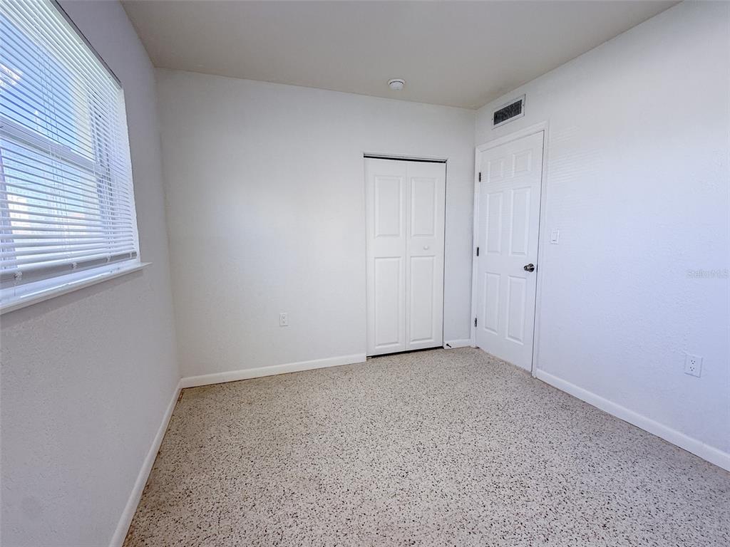111 177th Avenue West, Unit 3 Redington Shores, FL 33708 - Photo 10 of 16 a view of an empty room with a window