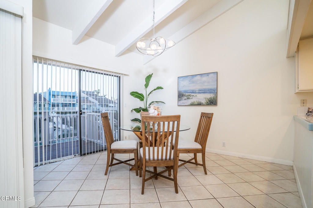 4625 Falkirk Bay Oxnard, CA 93035 - Photo 11 of 37 a view of a dining room with furniture a chandelier and a window