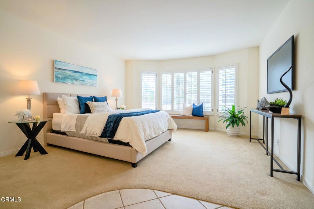 4625 Falkirk Bay Oxnard, CA 93035 - Photo 21 of 37 a spacious bedroom with a large bed and a couch