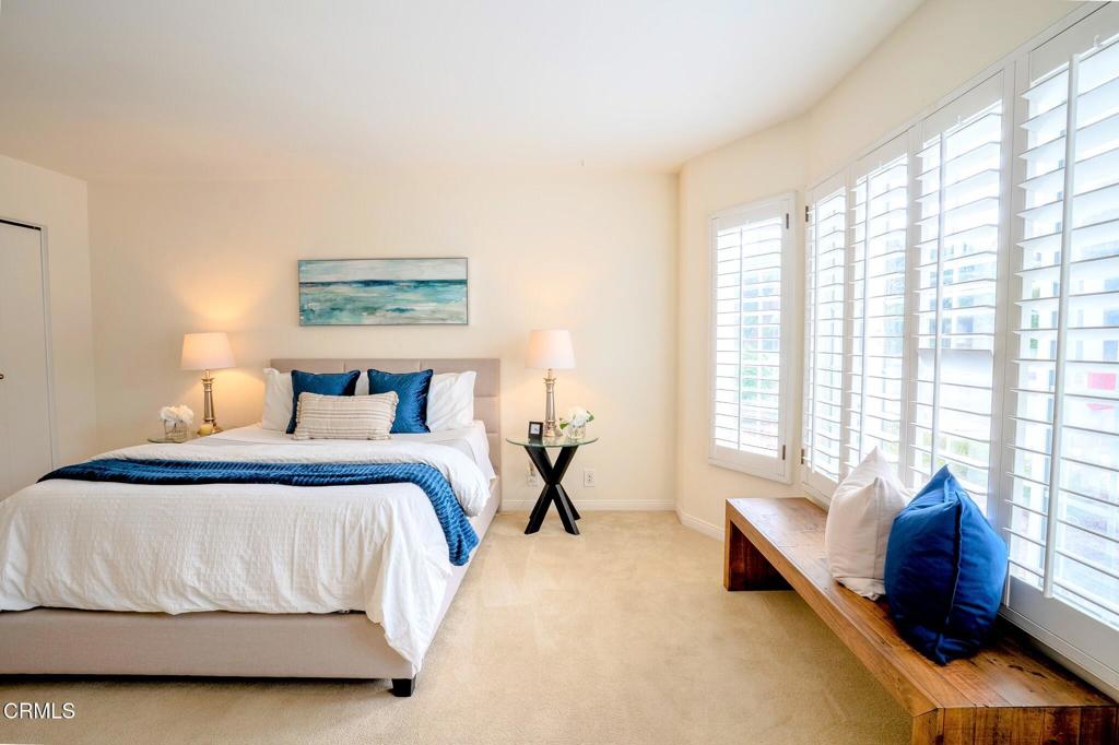 4625 Falkirk Bay Oxnard, CA 93035 - Photo 24 of 37 a bedroom with a bed and a couch