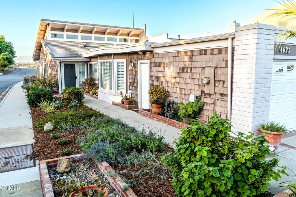 4625 Falkirk Bay Oxnard, CA 93035 - Photo 31 of 37 a front view of a house with a yard