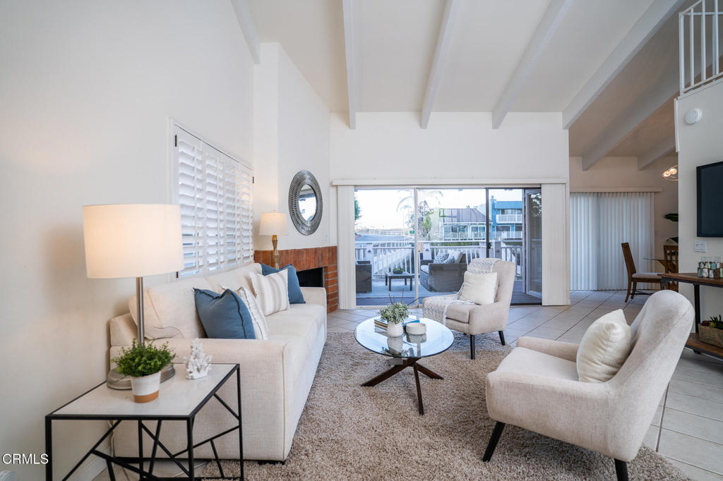 4625 Falkirk Bay Oxnard, CA 93035 - Photo 7 of 37 a living room with fireplace furniture and a large window