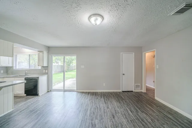 a view of an empty room and window