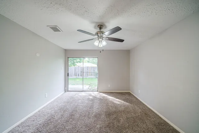 a bathroom with a sink a toilet and a large mirror