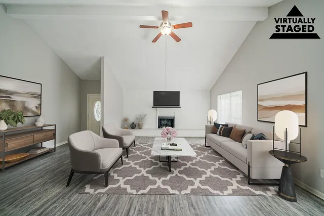 a living room with furniture fireplace and a flat screen tv