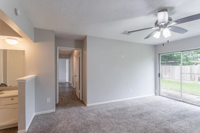 a bathroom with a sink toilet and a mirror