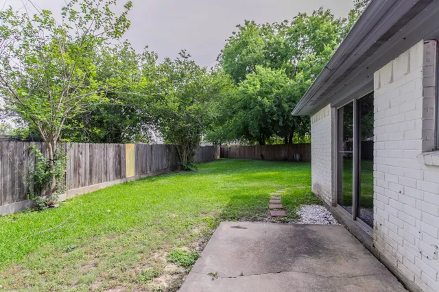 a house view with a garden space